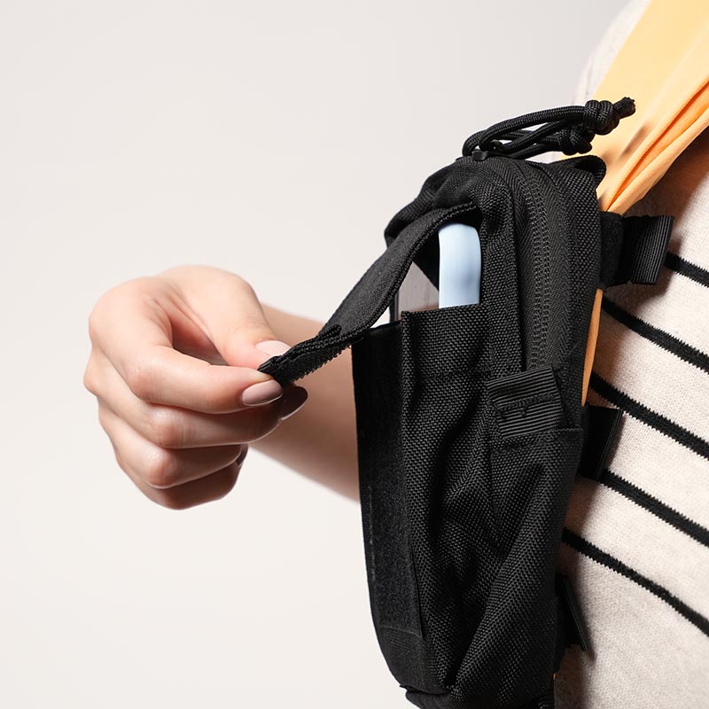 Nubioo Essentials Clip-On travel bag attached onto a toddler carrier. 