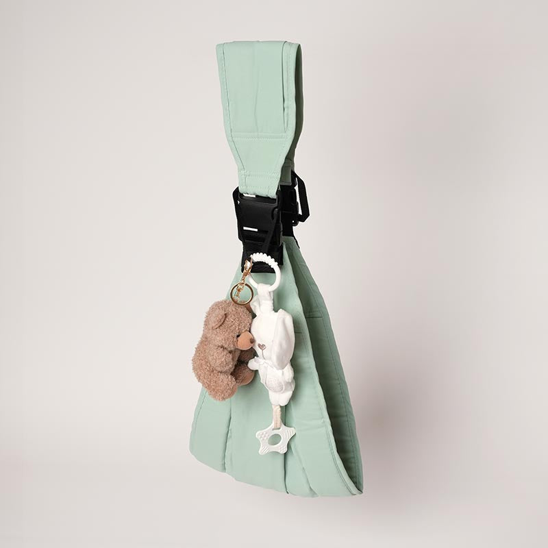 Nubioo toddler carrier with two plushy teething animal toys attached. 