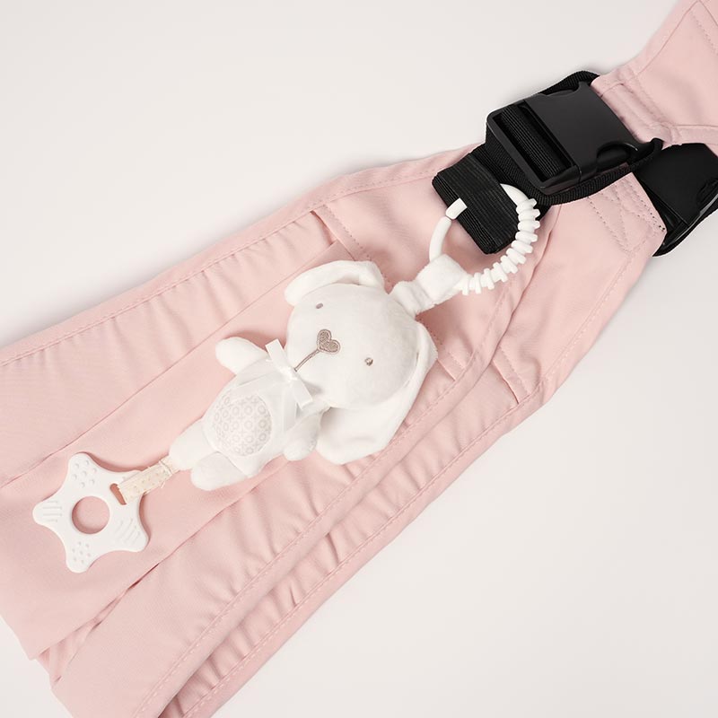 Nubioo Clip-On Soothie Rabbit attached onto a pink toddler carrier.